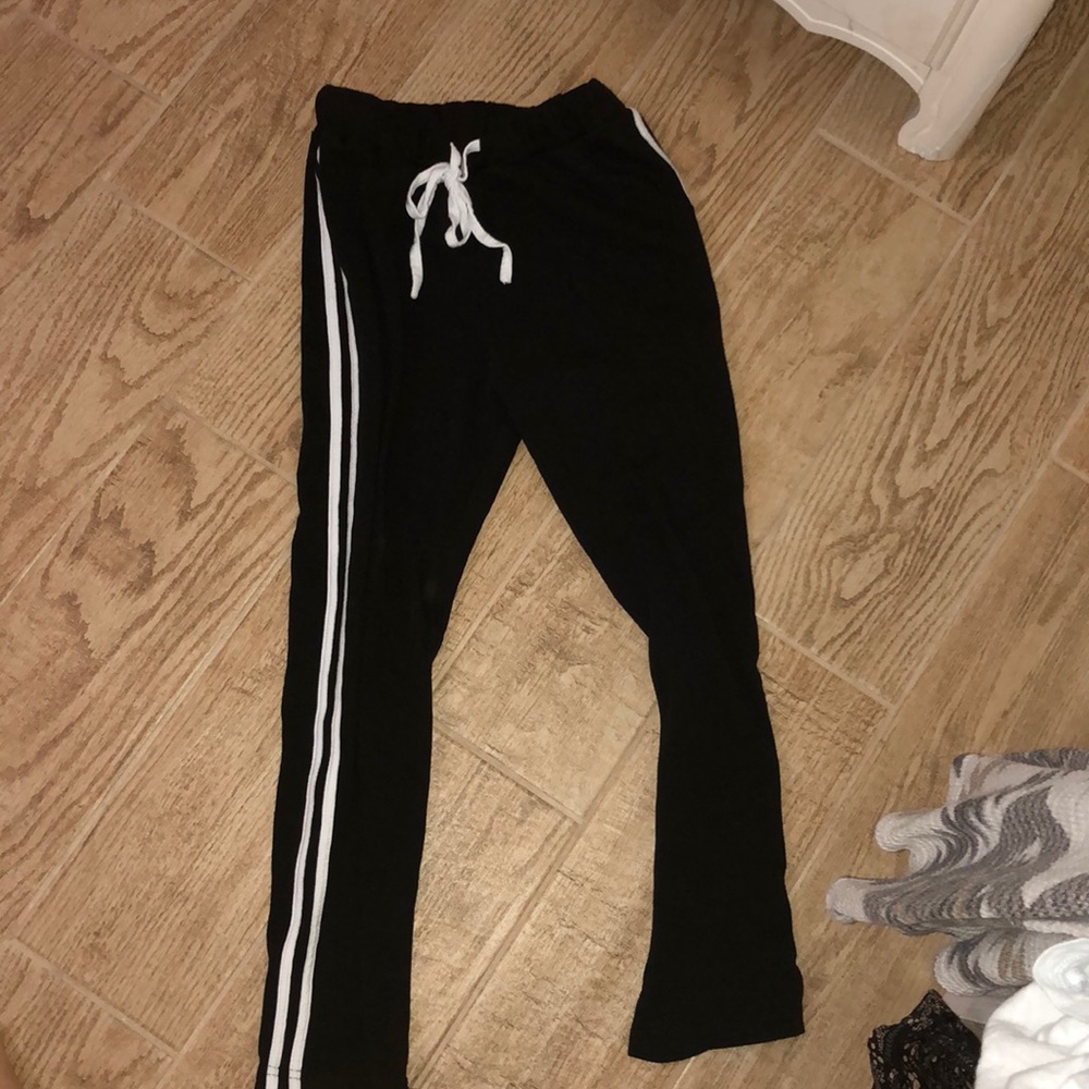 Adidas knockoff pants.